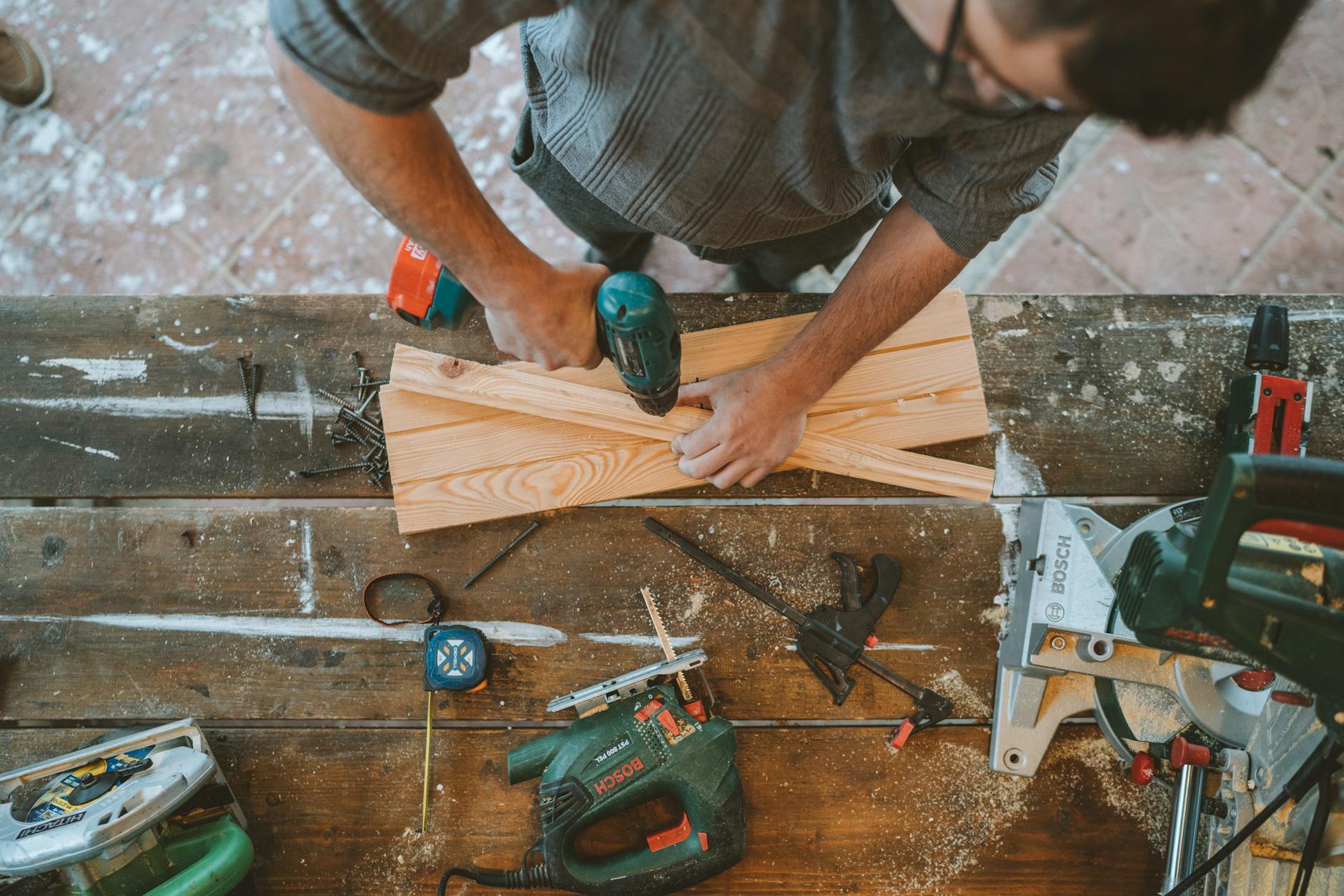 Craftsman working on a deck build